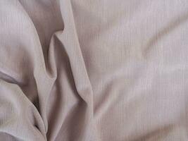 Fabric texture of natural cotton, wool, silk or linen textile material. Grey fabric background photo