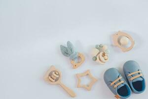 a wooden toy set with a blue shoe and a wooden toy photo