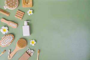 Directly above view of spa products on green background, Healthcare spa concept with copy space photo