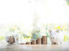 Piggy bank and stack of coins. The concept of save money for prepare in the future. photo