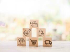 Wooden block with online shopping and e-commerce icons set. photo