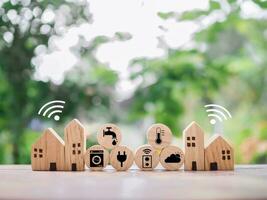 Miniature house with smart home icons. The concept of automation system technology for everythings in home. photo