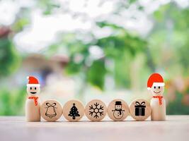 Wooden snowman with Christmas icons for Christmas decorations background photo