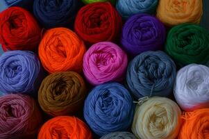 Blurry background of colorful knitting. View from above of colorful knitting. photo