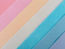 Pastel background, A stack of colorful fabric.Full frame shot of muti colored fabric background photo