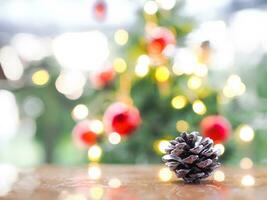 Close up of pinecones with Christmas light bokeh background. Merry Christmas and Happy New Year 2024 photo