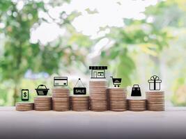 Shopping and e-commerce icons set on stack of coins, The concept of save for shopping. photo