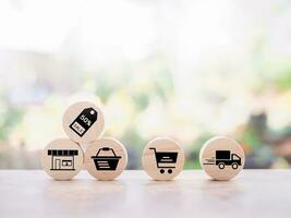 Wooden block with online shopping and e-commerce icons set. photo