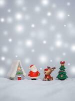 Raindeer and Santa claus in the town with shiny light for Christmas and New Year holidays background, Winter season, falling snow, Copy space for Christmas and New Year holidays greeting card. photo