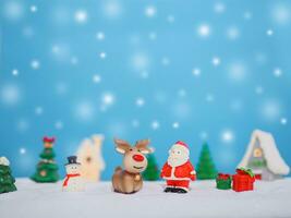 Raindeer and Santa claus in the town with shiny light for Christmas decoration photo