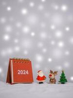 Close up calendar and christmas decoration with shiny light for New Year and Christmas 2024 concept. photo