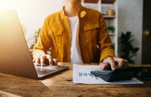 Business Man Financial Inspector and Secretary Making Report, Calculating or Checking Balance. Internal Revenue Service Inspector Checking Document Audit Concept photo