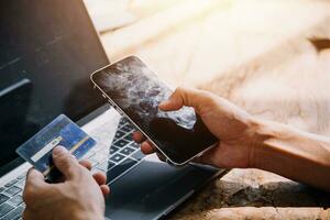 Businesswoman hands holding cradit card and using credit card online shopping. Online shopping concept photo