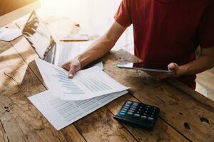 Business Man Financial Inspector and Secretary Making Report, Calculating or Checking Balance. Internal Revenue Service Inspector Checking Document Audit Concept photo