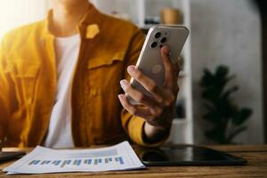 Business Man Financial Inspector and Secretary Making Report, Calculating or Checking Balance. Internal Revenue Service Inspector Checking Document Audit Concept photo