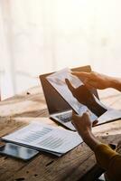 Business Man Financial Inspector and Secretary Making Report, Calculating or Checking Balance. Internal Revenue Service Inspector Checking Document Audit Concept photo