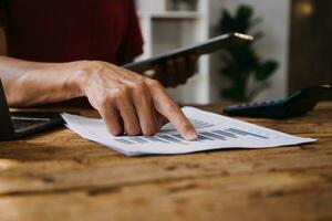 Business Man Financial Inspector and Secretary Making Report, Calculating or Checking Balance. Internal Revenue Service Inspector Checking Document Audit Concept photo