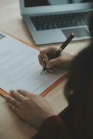 Business and lawyers discussing contract papers with brass scale on desk in office. Law, legal services, advice, justice and law concept picture with film grain effect photo