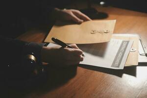 Business and lawyers discussing contract papers with brass scale on desk in office. Law, legal services, advice, justice and law concept picture with film grain effect photo