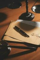 Business and lawyers discussing contract papers with brass scale on desk in office. Law, legal services, advice, justice and law concept picture with film grain effect photo