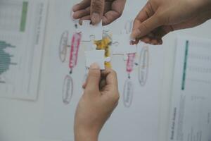 Cropped shot of Businesswoman hand connecting jigsaw puzzle with sunlight effect, Business solutions, success, and Assembling jigsaw pieces, strategy ideas. photo