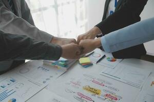 A group of businesspeople and investors meet to discuss market's success in past quarter. idea of setting up a marketing consulting team and working together as a team made it a success. photo