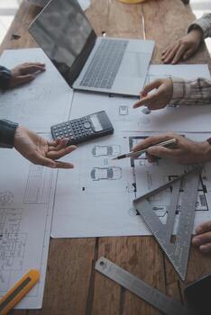 Construction and structure concept of engineer working drawing on blueprint meeting for project working with partner on model building and engineering tools in working site, construction concept. photo