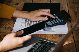 Business Man Financial Inspector and Secretary Making Report, Calculating or Checking Balance. Internal Revenue Service Inspector Checking Document Audit Concept photo