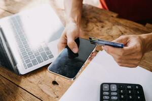 Businesswoman hands holding cradit card and using credit card online shopping. Online shopping concept photo