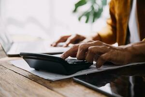 Business Man Financial Inspector and Secretary Making Report, Calculating or Checking Balance. Internal Revenue Service Inspector Checking Document Audit Concept photo