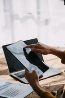 Business Man Financial Inspector and Secretary Making Report, Calculating or Checking Balance. Internal Revenue Service Inspector Checking Document Audit Concept photo