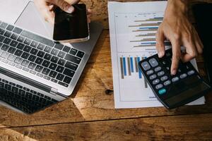Business Man Financial Inspector and Secretary Making Report, Calculating or Checking Balance. Internal Revenue Service Inspector Checking Document Audit Concept photo
