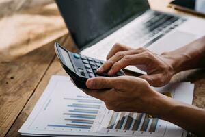 Business Man Financial Inspector and Secretary Making Report, Calculating or Checking Balance. Internal Revenue Service Inspector Checking Document Audit Concept photo