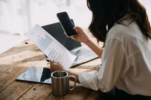 Business Man Financial Inspector and Secretary Making Report, Calculating or Checking Balance. Internal Revenue Service Inspector Checking Document Audit Concept photo
