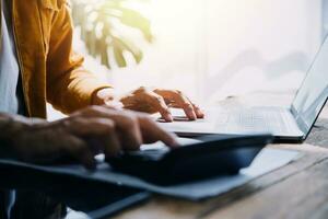 Business Man Financial Inspector and Secretary Making Report, Calculating or Checking Balance. Internal Revenue Service Inspector Checking Document Audit Concept photo