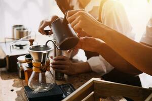 Happy young adult couple making breakfast and drinking coffee together in cozy home kitchen in morning at home. Preparing meal and smiling. Lifestyle, leisure and Love concept. photo