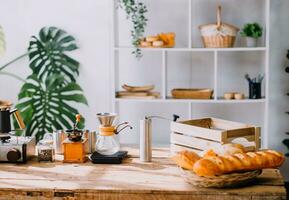 Happy young adult couple making breakfast and drinking coffee together in cozy home kitchen in morning at home. Preparing meal and smiling. Lifestyle, leisure and Love concept. photo