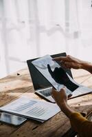 Business Man Financial Inspector and Secretary Making Report, Calculating or Checking Balance. Internal Revenue Service Inspector Checking Document Audit Concept photo
