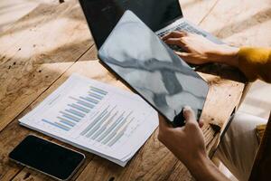 Business Man Financial Inspector and Secretary Making Report, Calculating or Checking Balance. Internal Revenue Service Inspector Checking Document Audit Concept photo