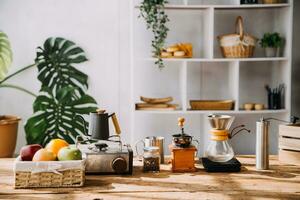 Happy young adult couple making breakfast and drinking coffee together in cozy home kitchen in morning at home. Preparing meal and smiling. Lifestyle, leisure and Love concept. photo