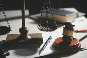 Business and lawyers discussing contract papers with brass scale on desk in office. Law, legal services, advice, justice and law concept picture with film grain effect photo