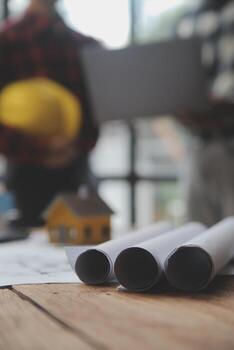 Engineer Teamwork Meeting, Drawing working on blueprint meeting for project working with partner on model building and engineering tools in working site, Construction and structure concept. photo