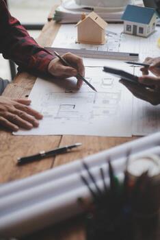 Engineer Teamwork Meeting, Drawing working on blueprint meeting for project working with partner on model building and engineering tools in working site, Construction and structure concept. photo