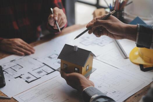 Engineer Teamwork Meeting, Drawing working on blueprint meeting for project working with partner on model building and engineering tools in working site, Construction and structure concept. photo