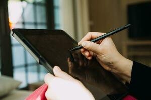 Shot of a asian young business Female working on laptop in her workstation. photo