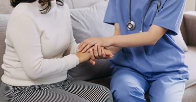 Homecare nursing service and elderly people cardiology healthcare. Close up of young hispanic female doctor nurse check mature caucasian man patient heartbeat using stethoscope during visit photo