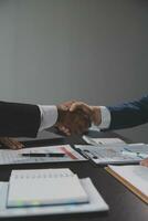 Business handshake for teamwork of business merger and acquisition,successful negotiate,hand shake,two businessman shake hand with partner to celebration partnership and business deal concept photo