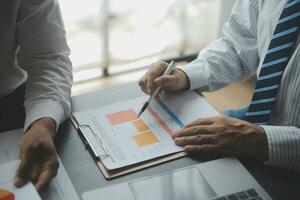Financial Business woman analyze the graph of the company's performance to create profits and growth, Market research reports and income statistics, data,repotr,Financial and Accounting concept. photo