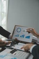Team of business people working together in the meeting room office, teamwork background charts and graphs banner, double exposure successful teamwork,business planning concept. photo