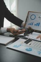 Team of business people working together in the meeting room office, teamwork background charts and graphs banner, double exposure successful teamwork,business planning concept. photo